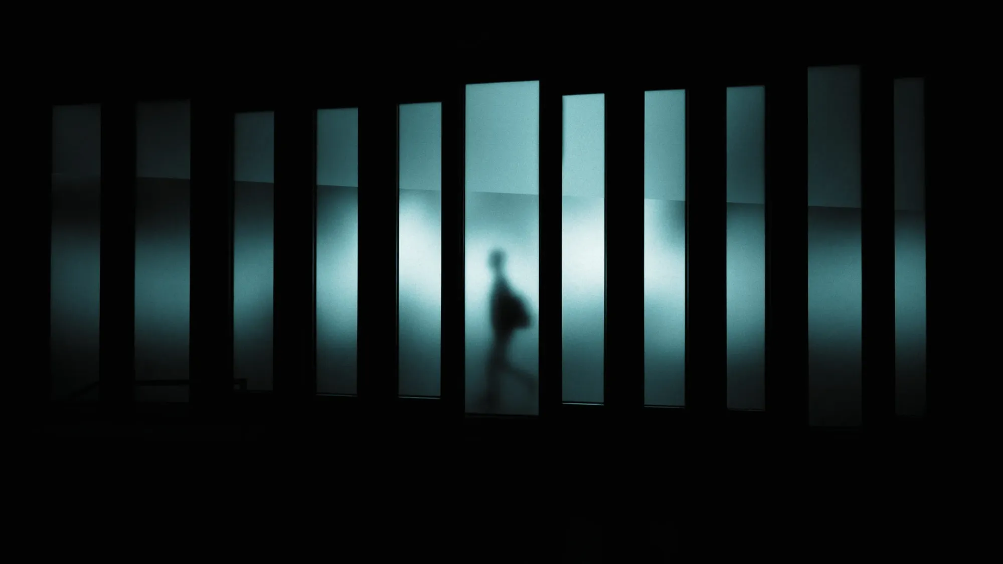 Artistically blurred image of person walking at Museu del Disseny de Barcelona.