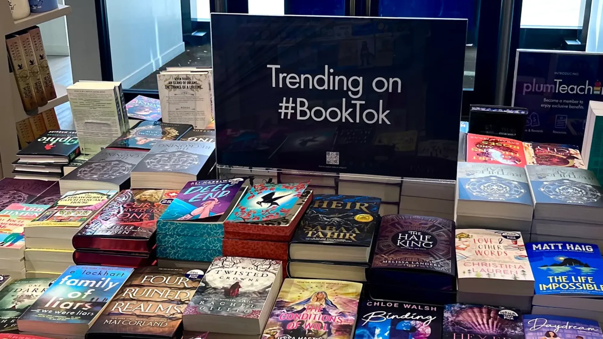 Bookstore table with a sign that reads "Trending on #BookTok".
